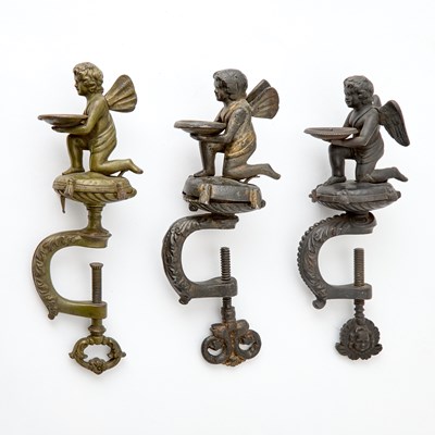 Lot 227 - Thee Cast Iron Cupid Sewing Clamps