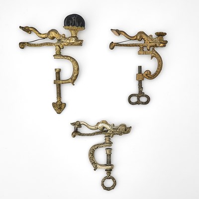 Lot 281 - Three Gilt Brass Dolphin Sewing Clamps