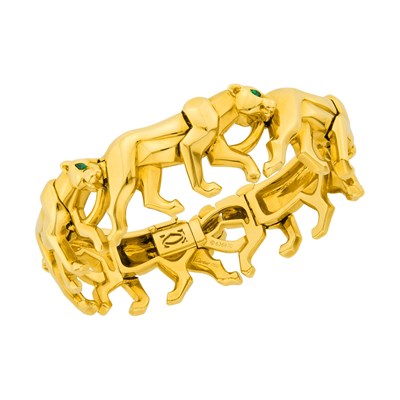 Lot 23 - Cartier Gold and Emerald 'Nakoura' Panther Bracelet, France