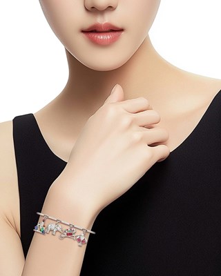 Lot 154 - Platinum, Gold, Diamond, Gem-Set and Enamel Charm Bracelet