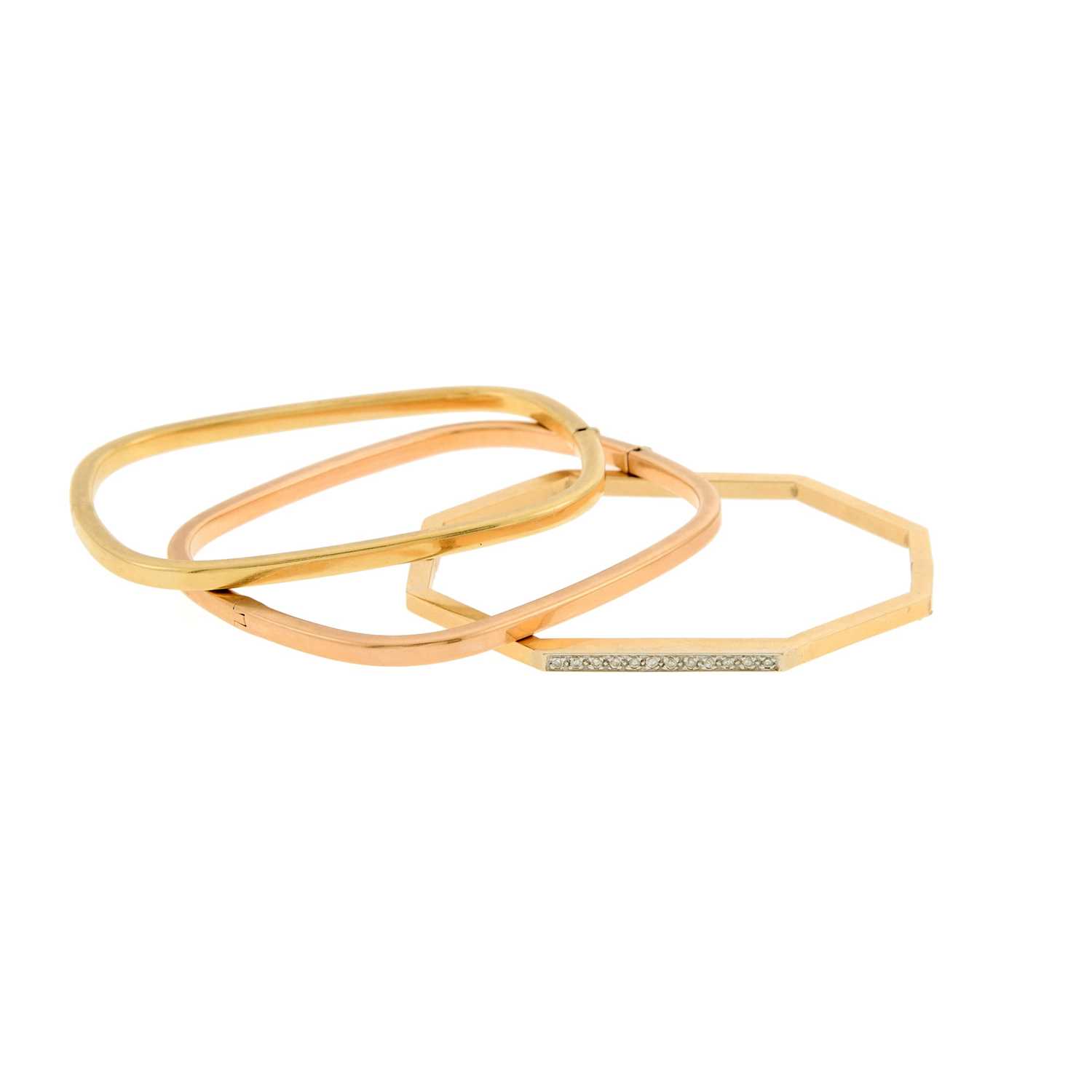 Lot 2060 - Three Yellow and Rose Gold and Diamond Bangle Bracelets