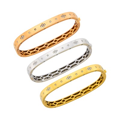 Lot 32 - Three Tricolor Gold and Diamond Bangle Bracelets