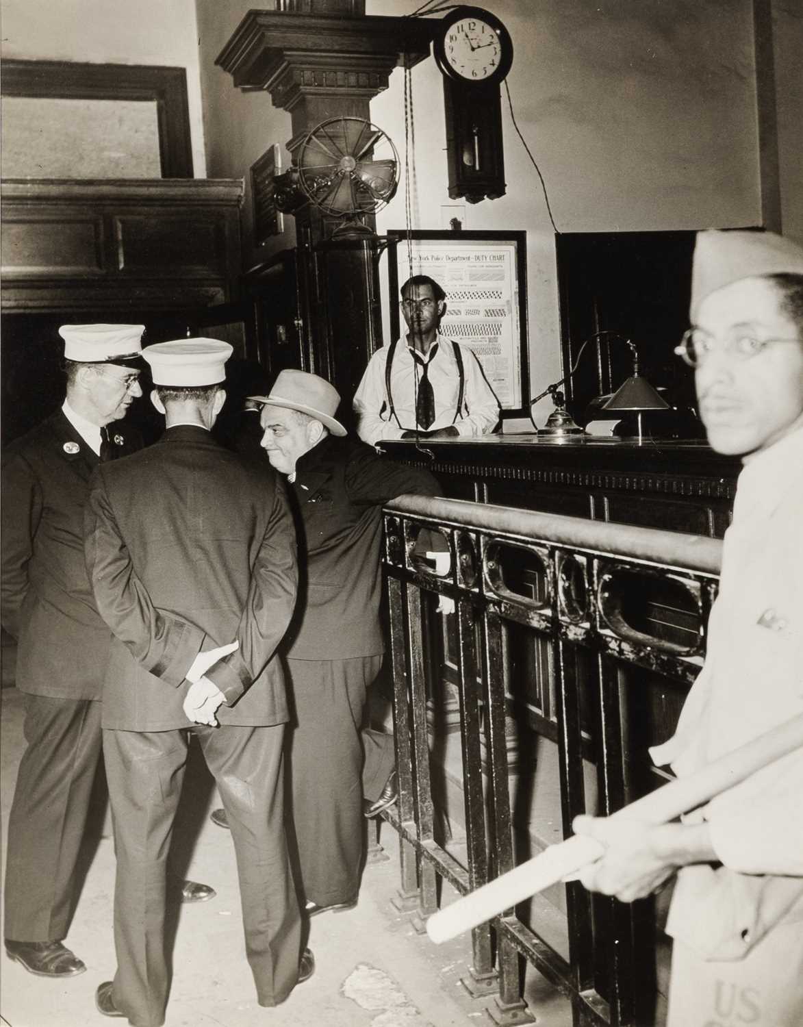 Lot 96 - Weegee, [Fiorello] La Guardia, West 123rd Street Police Station, 1943