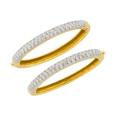 Lot 87 - Pair of Two-Color Gold and Diamond Bangle Bracelets