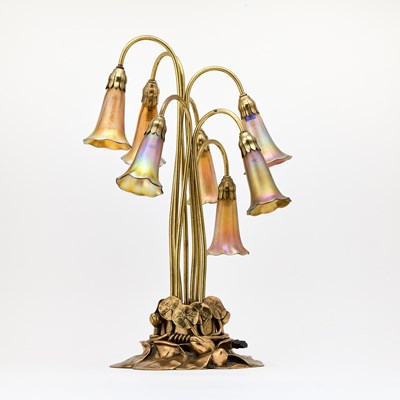 Lot 239 - Tiffany Studios Gilt-Bronze and Favrile Glass Seven-Light Pond Lily Table Lamp