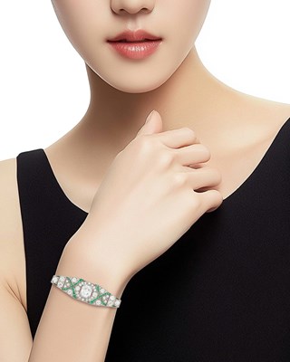 Lot 65 - Platinum, Diamond and Emerald Bracelet