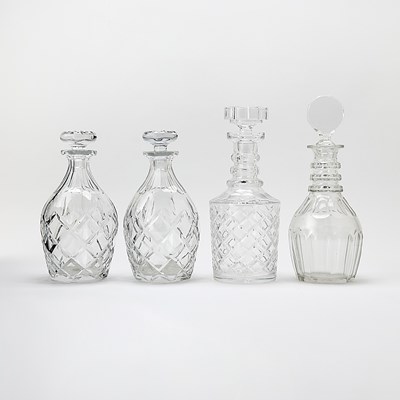Lot 54 - Group of Four Blown and Cut Lead Crystal Glass Decanters and Stoppers