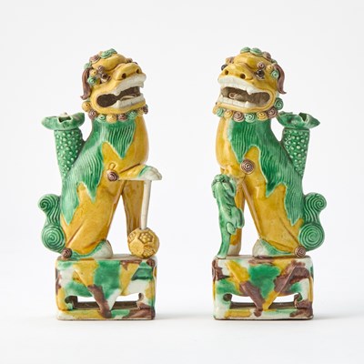 Lot 522 - A Pair of Chinese Glazed Biscuit Porcelain Fu Lions