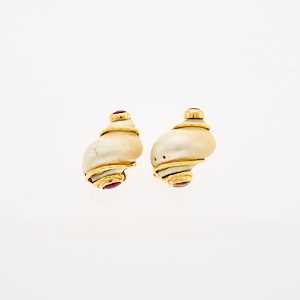 Lot 2174 - Seaman Schepps Pair of Gold, Shell and Cabochon Ruby 'Small Turbo Shell' Earclip Fragments