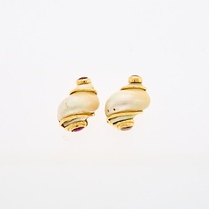 Lot 2174 - Seaman Schepps Pair of Gold, Shell and Cabochon Ruby 'Small Turbo Shell' Earclip Fragments