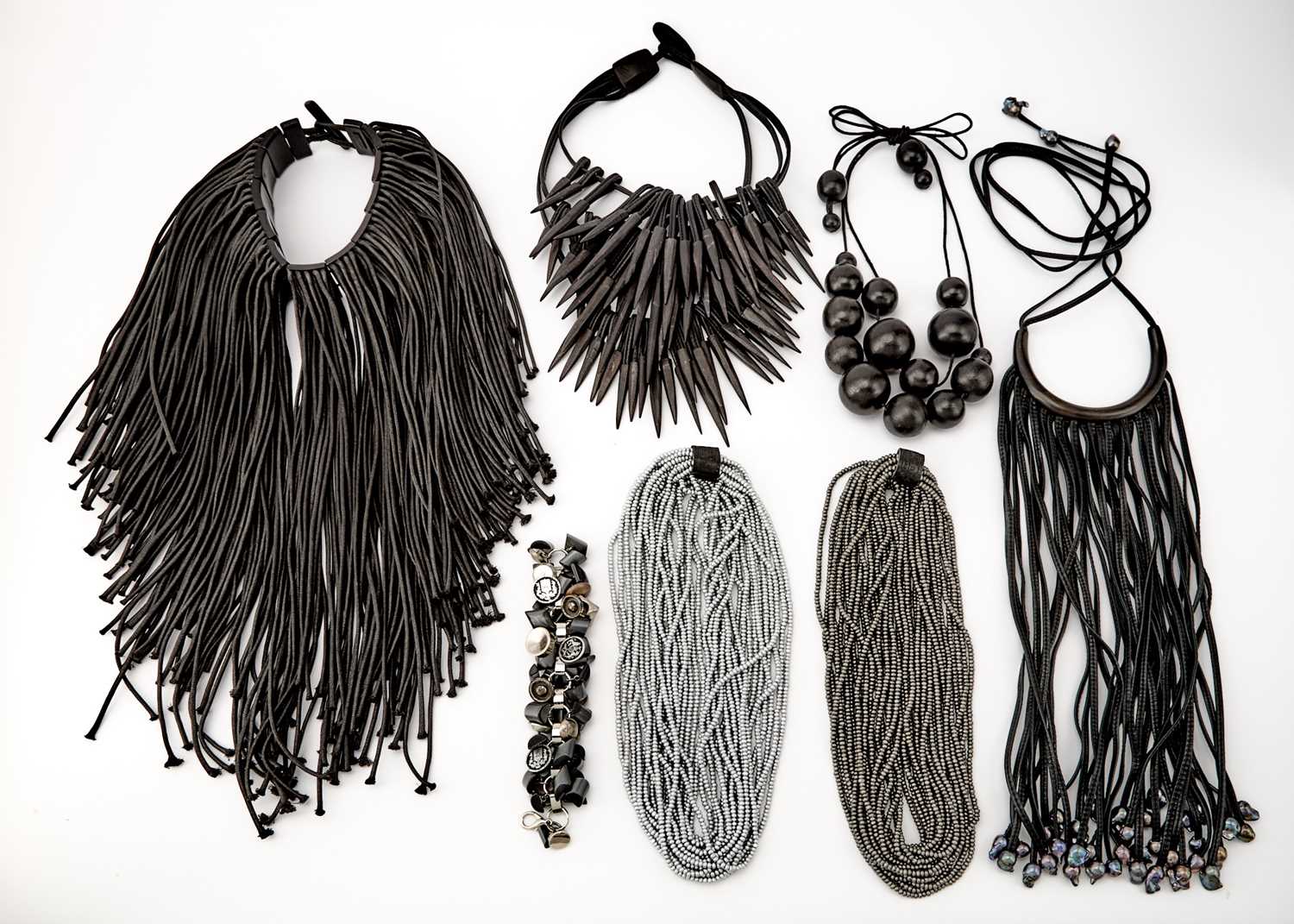 Lot 1018 - Group of Six Leather, Wood and Cloth Necklaces