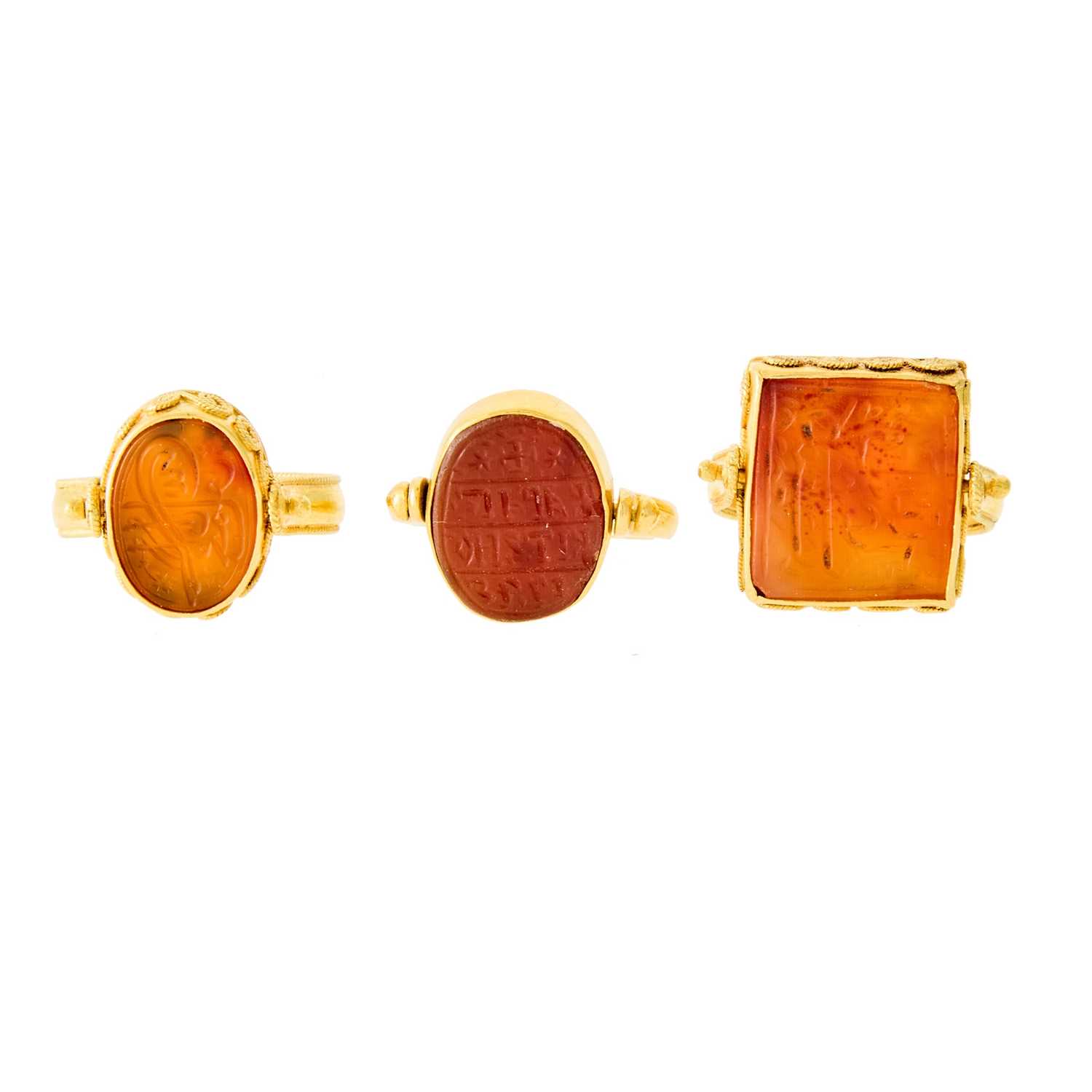 Lot 1034 - Three High Karat Gold and Carnelian Intaglio Rings