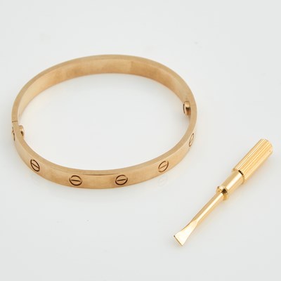 Lot 93 - Gold Rigid Bracelet, 18K 23 dwt., bears signature Cartier with metal screw driver and pouch