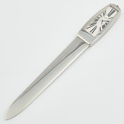Lot 247 - Stainless Steel Letter Opener with clock with box and papers, bears signature Cartier