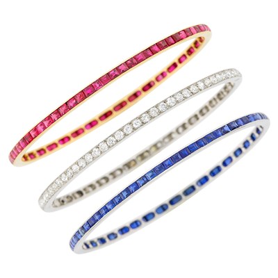 Lot 231 - Three Platinum, Gold, Diamond, Ruby and Sapphire Bangle Bracelets