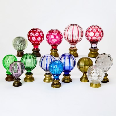 Lot 532 - Group of Fourteen Glass and Brass Newel Finials