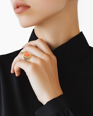 Lot 10 - Gold, Coral, Diamond and Cabochon Sapphire Ring