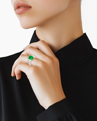 Lot 54 - Two-Color Gold, Emerald and Diamond Ring