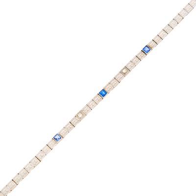 Lot 1143 - Platinum, Gold, Sapphire and Diamond Bracelet