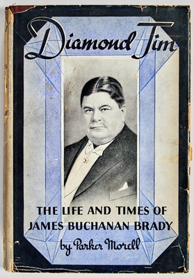 Lot 101 - A biography of Diamond Jim, the extravagant Gilded Age businessman, with a faux diamond inset to the cover