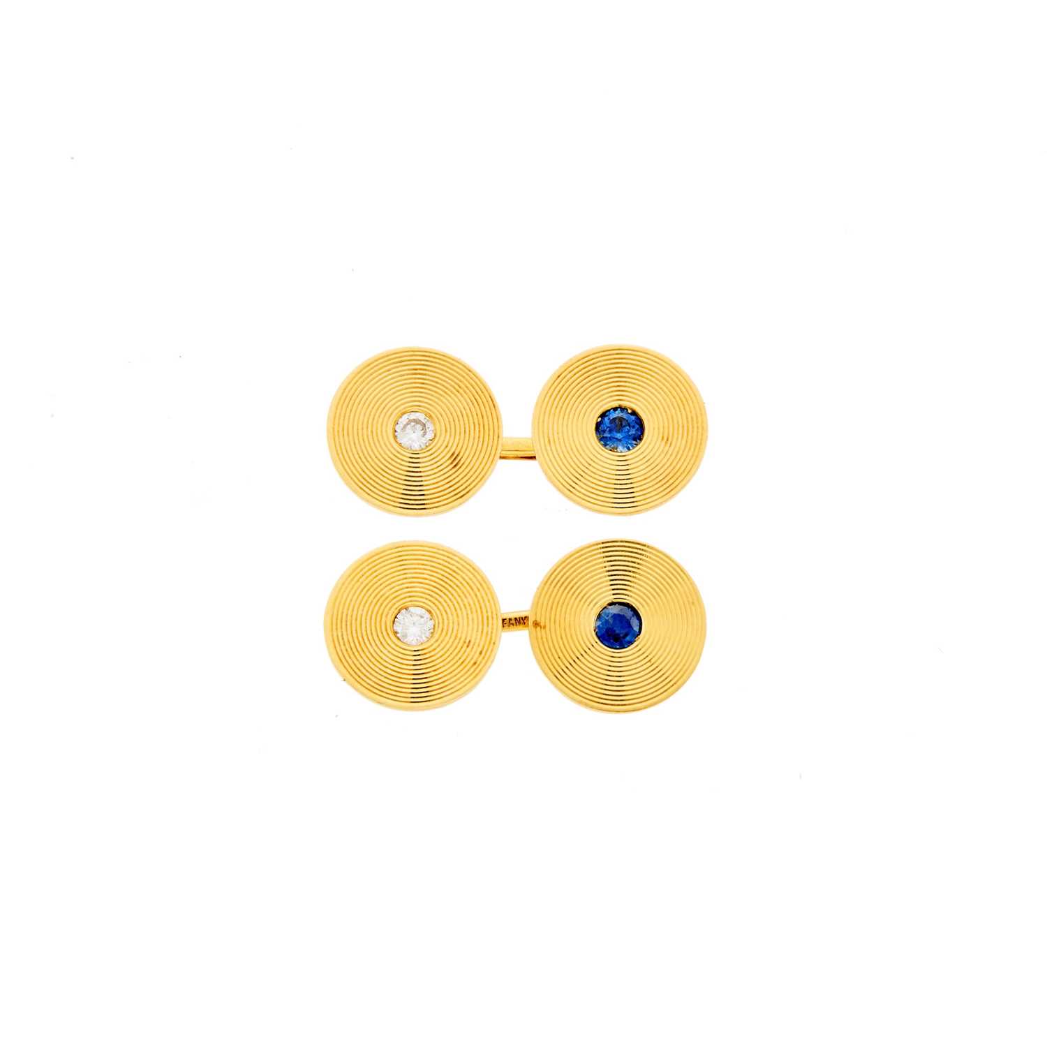 Lot 1009 - Tiffany & Co. Pair of Gold, Sapphire and Diamond Cufflinks