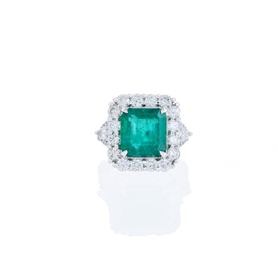 Lot 1104 - Platinum, Emerald and Diamond Ring