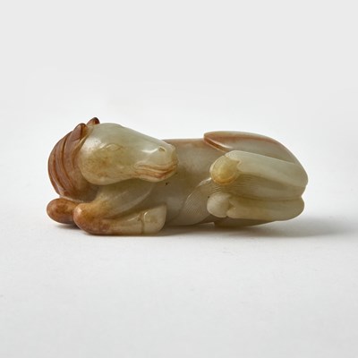 Lot 319 - A Chinese Celadon and Russet Jade Figure of a Horse