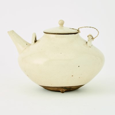 Lot 516 - A White Crackle Glazed Pottery Teapot