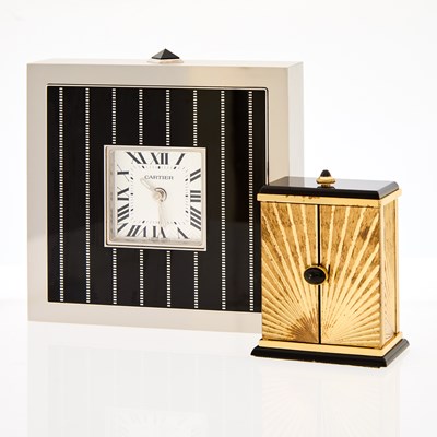 Lot 1236 - Cartier Gold-Plated and Black Onyx Triptych Travel Clock and Stainless Steel and Black Lacquer Desk Clock