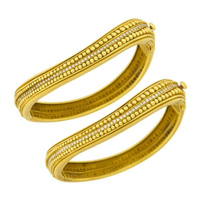 Lot 136 - Barry Kieselstein-Cord Pair of Gold and Diamond Bangle Bracelets