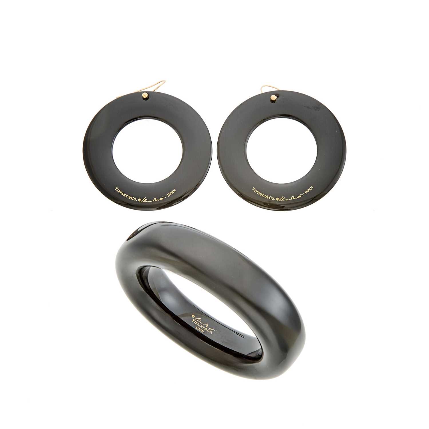 Lot 1050 - Tiffany & Co., Elsa Peretti Black Lacquer 'Doughnut' Bangle Bracelet and Pair of Pendant-Earrings