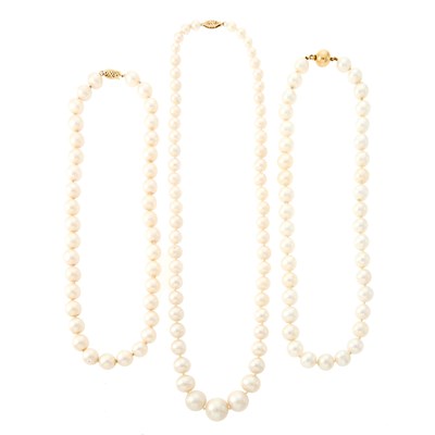 Lot 1098 - Three Freshwater Pearl Necklaces with Gold Clasps