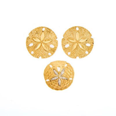 Lot 1076 - Two-Color Gold and Diamond Sand Dollar Pendant-Brooch and Pair of Earrings