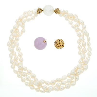 Lot 2173 - Triple Strand Baroque Freshwater Pearl Necklace with Interchangeable Gold, Carved Rock Crystal and Amethyst Bead Ball Clasps