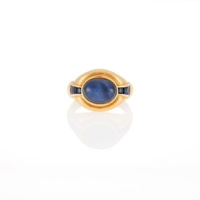 Lot 1166 - Gold, Cabochon Sapphire and Sapphire Ring