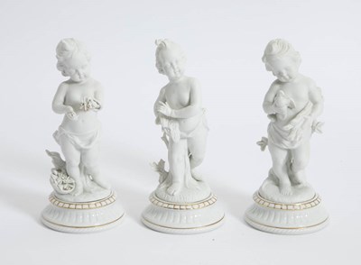 Lot 375 - Group of Three Bisque Porcelain Putti Figures