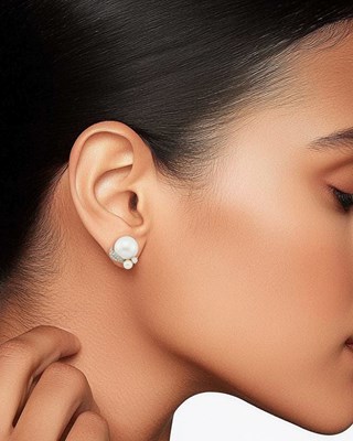 Lot 76 - Seaman Schepps Pair of White Gold, Three-Quarter Cultured Pearl, Cultured Pearl and Diamond Earclips