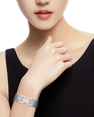 Lot 77 - White Gold and Diamond Link Bracelet