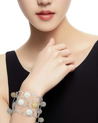 Lot 48 - White Gold, South Sea and Golden Cultured Pearl, Diamond and Colored Diamond Cuff Bangle Bracelet