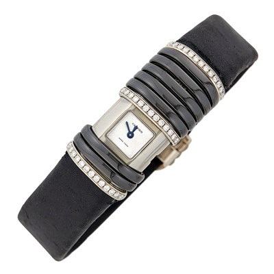 Lot 1078 - Cartier Titanium, White Gold, Black Onyx and Diamond 'Declaration' Wristwatch, Ref. 306