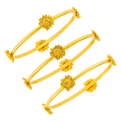 Lot 121 - Asprey Three Gold Sunflower Bangle Bracelets