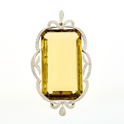 Lot 1202 - White Gold, Lemon Quartz and Diamond Enhancer Pendant