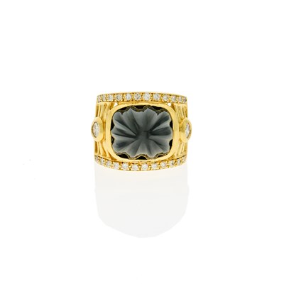 Lot 1173 - Gold, Carved Black Onyx and Diamond Ring