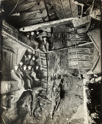 Lot 365 - A striking photograph of workers in the Holland Tunnel, when the New York and New Jersey sides met