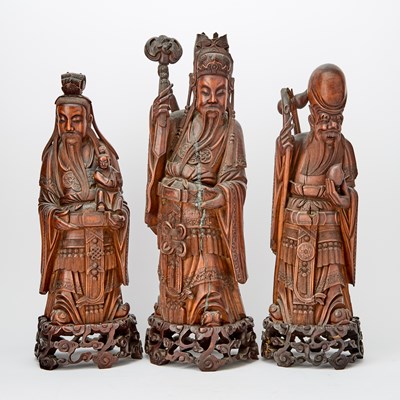 Lot 101 - A Group of Chinese Carved Wood Figures of Fu, Lu, and Shou