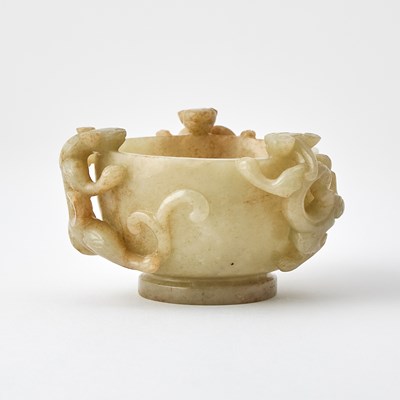 Lot 325 - A Chinese Carved Celadon and Russet Jade Cup