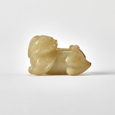 Lot 346 - A Chinese Celadon and Russet Jade Beast
