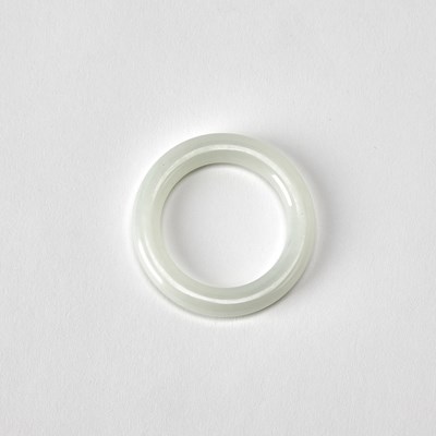 Lot 411 - A Chinese White Jade Buddhist Ring