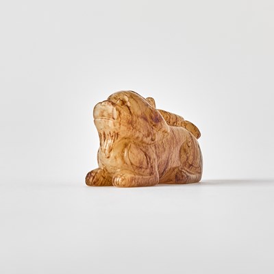 Lot 344 - A Chinese Mottled Jade Carving of a Pixiu