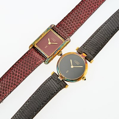 Lot 1245 - Must de Cartier Two Gold Vermeil and Silver Wristwatches